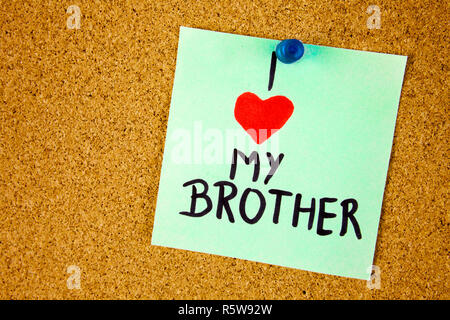 i love my brother text on sticky note over notice board. room for text. Stock Photo