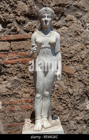 AT POMPEI - ON 06/22/ 2017 -  Statue representing Iside in the ancient roman town of Pompeii, destroyed by vesuvius eruption in 70 d.c. Stock Photo