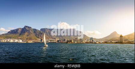 Panoramic seaside view of Cape Town with Table Mountain and Lions Head in the backdrop Stock Photo
