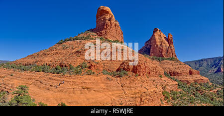 Four people hiking, Center Spire and Eastern Mitten Ridge, Sedona, Arizona, United States Stock Photo