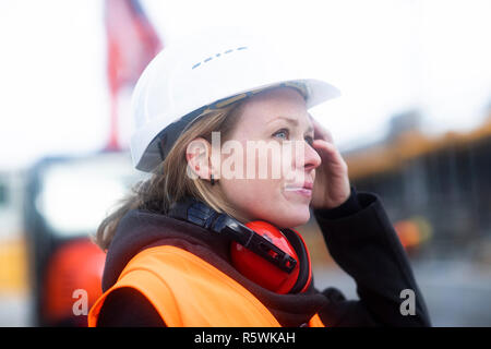 Portrait of a woman on a construction site Stock Photo
