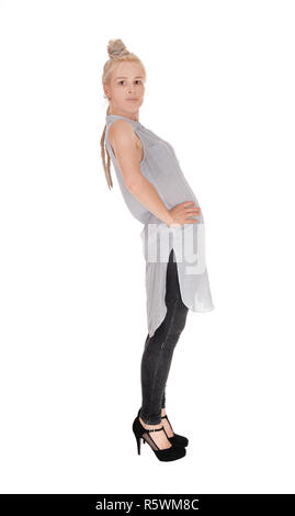 Slim woman standing in profile Stock Photo