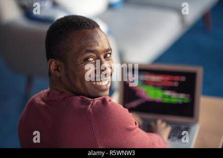 Close-up Of Person Typing On Laptop At startup office. Stock Photo