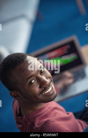 Close-up Of Person Typing On Laptop At startup office. Stock Photo