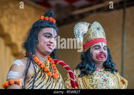 Two artists dressed as Hindu gods on a stega, Pushkar, Rajasthan, India Stock Photo