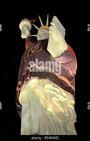 Statue of Liberty wearing a Golden Knights jersey lit up at night in Las Vegas Nevada Stock Photo