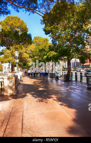 People walking along the Parisian sidewalk in Paris, Las Vegas, Nevada Stock Photo