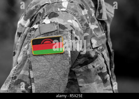 Malawi flag on soldiers arm (collage). Stock Photo