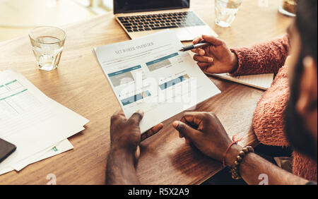Managers doing a performance analysis of the business in office. business colleagues discussing work in office. Stock Photo