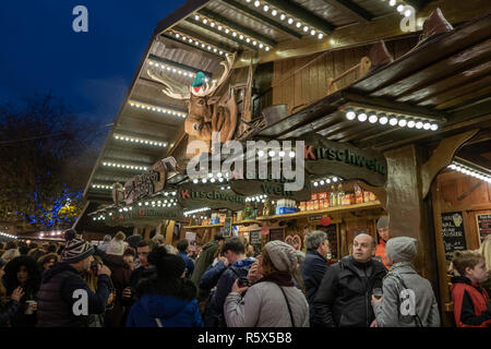 02 December 2018, Manchester Christmas Market, People enjoying the atmosphere in front of the Zum Lustigen Rudolph bar. Stock Photo