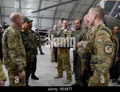 Gen. Stephen Wilson, Vice Chief of Staff of the Air Force, is briefed by Train, Advise, Assist Command-Air (TAAC-Air) Mi-17 advisors, on their day-to-day mission working with the Afghan Air Force at Kabul Air Wing, Afghanistan, April 13, 2017. Wilson; Chief Master Sgt. of the Air Force Kaleth O. Wright; Maj. Gen. James Hecker, 9th Air and Space Expeditionary Task Force-Afghanistan commander; and Chief Master Sgt. Lisa Arnold, 9th AETF-A command chief; visited the 438th Air Expeditionary Wing and TAAC-Air. Brig. Gen. David Hicks, 438th AEW and TAAC-Air commander, and a contingent of TAAC-Air Co Stock Photo