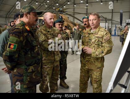 Brig. Gen. David Hicks, 438th Air Expeditionary Wing and Train, Advise, Assist Command-Air (TAAC-Air) commander, briefs Gen. Stephen Wilson, Vice Chief of Staff of the Air Force, about the success of the Afghan Air Force C-208 mission at Kabul Air Wing, Afghanistan, April 13, 2017. Wilson; Chief Master Sgt. of the Air Force Kaleth O. Wright; Maj. Gen. James Hecker, 9th Air and Space Expeditionary Task Force-Afghanistan commander; and Chief Master Sgt. Lisa Arnold, 9th AETF-A command chief; visited the 438th AEW and TAAC-Air. Hicks and a contingent of TAAC-Air Coalition and AAF members gave the Stock Photo