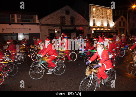 Cork City, Cork, Ireland. 02nd December 2018. Some of the 400 Santa's setting off in the Santa Cycle to raise funds for the medical support group Straight Ahead which provides surgery, support and medical equipment for children with orthopaedic conditions in Cork, Ireland. Credit: David Creedon/Alamy Live News Stock Photo