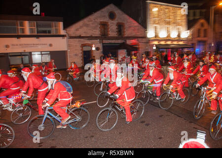 Cork City, Cork, Ireland. 02nd December 2018. Some of the 400 Santa's setting off in the Santa Cycle to raise funds for the medical support group Straight Ahead which provides surgery, support and medical equipment for children with orthopaedic conditions in Cork, Ireland.Credit: David Creedon/Alamy Live News Stock Photo
