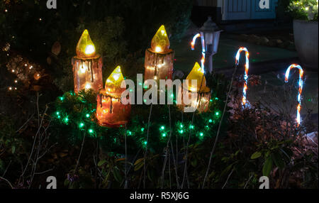 Berlin, Germany. 27th Nov, 2018. The Domagalla family garden is decorated with Christmas lights. Lamps that represent candy canes and an Advent calendar are chosen as decoration. Credit: Paul Zinken/dpa/Alamy Live News Stock Photo