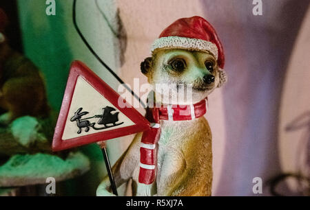 Berlin, Germany. 27th Nov, 2018. A meerkat figure disguised as Santa Claus stands in a garden in Berlin. Credit: Paul Zinken/dpa/Alamy Live News Stock Photo