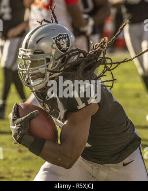 Oakland Raiders wide receiver Dwayne Harris (17) is pursued by Baltimore  Ravens tight end Nick Boyle (86) during the fourth quarter of an NFL game  at M&T Bank Stadium in Baltimore, Maryland