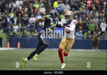 Seattle Seahawks defensive back Neiko Thorpe (27) and strong safety Jeron  Johnson gang tackle's Detroit Lions wide receiver Andre Roberts (12) in a  Wild Card round of the NFL playoffs at CenturyLink