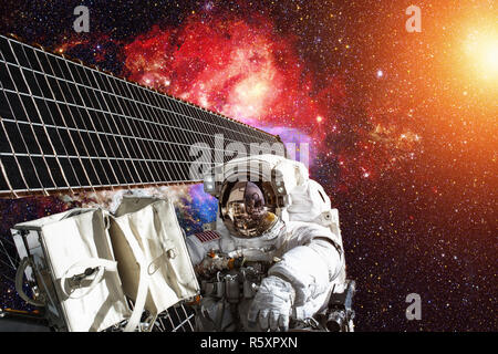 International Space Station and astronaut in outer space over the planet Earth.