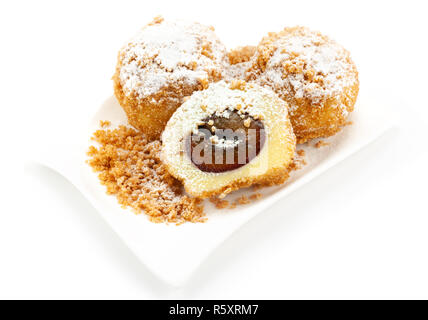 Plum dumplings on white background Stock Photo