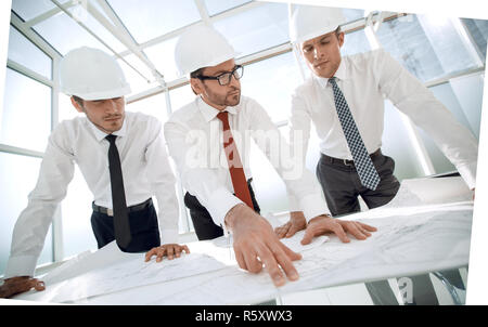 group of architects discussing sketches Stock Photo