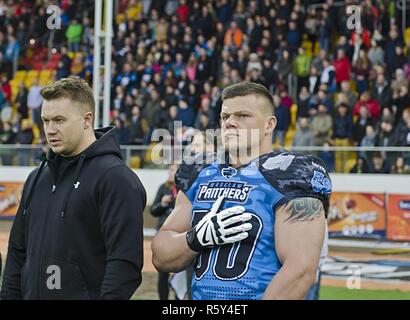 Wroclaw Panthers’ Defensive Lineman, Simon Adamczyk, honors the Polish National Anthem during the opening ceremony at Olympic Stadium in Wroclaw, Poland April 22, 2017. In support of Operation Atlantic Resolve, 3rd Battalion, 29th Field Artillery Regiment, 3rd Armored Brigade Combat Team, 4th Infantry Division, priority is to sustain interoperability with their Polish allies, however, integrating U.S. Soldiers into local events helps strengthen relationships within Polish communities. Stock Photo