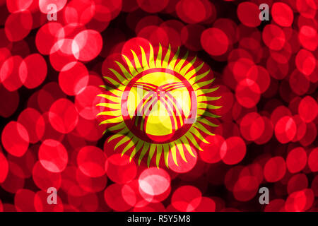 Kyrgyzstan abstract blurry bokeh flag. Christmas, New Year and National day concept flag. Stock Photo
