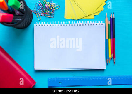 Back to school. Items for the school on a blue wooden table. Stock Photo