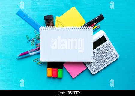 Back to school. Items for the school on a blue wooden table. Stock Photo