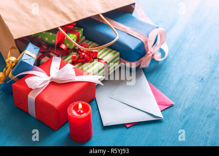 Gift bag overturned on the table Stock Photo