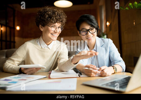 Cheerful marketing team analyzing information Stock Photo