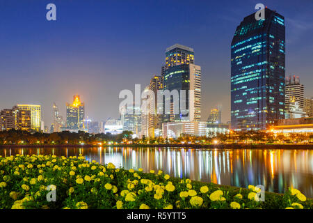 Building city in business area night scene with river reflection in Bangkok, Thailand. Stock Photo