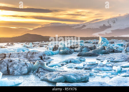 Beautiful sunset at Iceland with the icebergs floating around Stock Photo