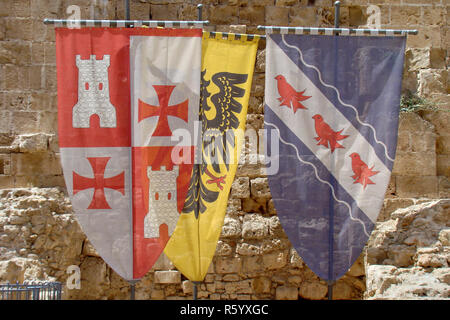 Three old Crusaders flags and coat of arms Stock Photo