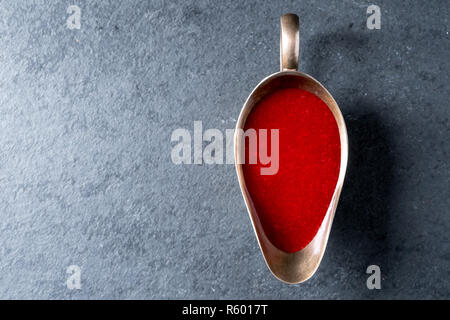 Cranberry sauce in a gravy boat on gray slate free space Stock Photo
