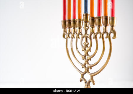 Hanukkah with candles, plates, butter in a bowl and blue napkin top view Stock Photo