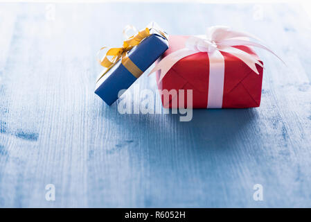 Two gift boxes on blue table Stock Photo