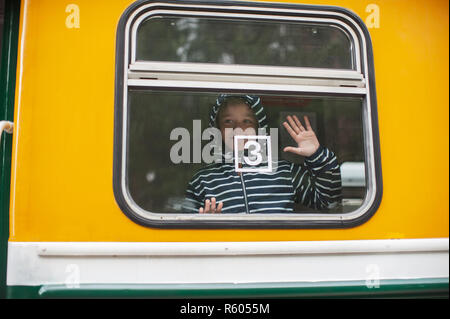 Adorable boy on a train Stock Photo