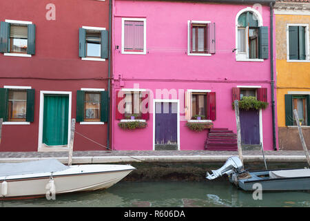 Colorful small, brightly painted houses on the island of Burano, Venice, Italy Stock Photo