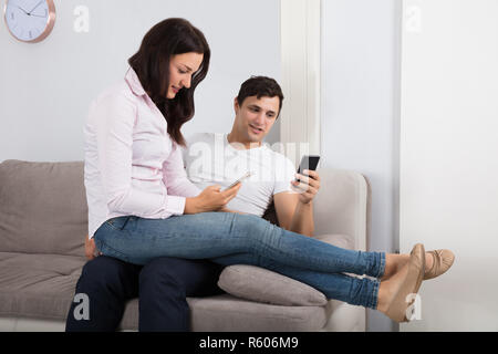 Couple Using Mobile Stock Photo