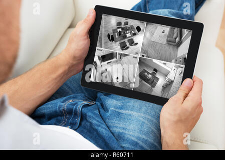 Person Watching News On Digital Tablet Stock Photo
