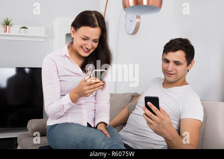 Couple Using Mobile Stock Photo