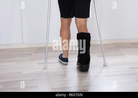 Low Section View Of An Injured Person's Leg Stock Photo