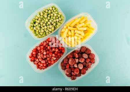 Food packaging ingredients, healthy frozen vegetables, cooking from freezer container. Stock Photo