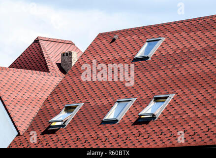 Decorative metal tile on a roof Stock Photo