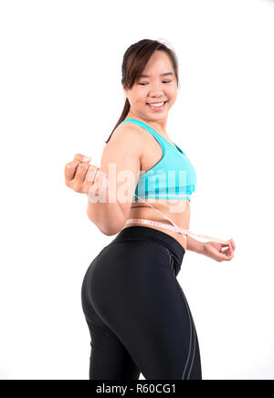 chubby  woman measuring her waistline Stock Photo
