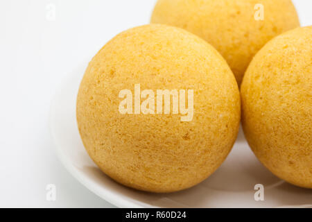 Traditional Colombian buÃ±uelos (Deep Fried Cheese Bread) isolated on white background Stock Photo