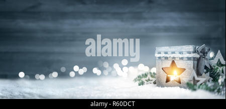 christmas wood background with lanterns,fir branches and lights Stock Photo