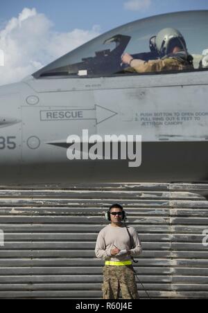 Senior Airman Kevin Ly, a 455th Expeditionary Aircraft Maintenance Squadron weapons load crew member, performs a post-flight check April 25, 2017, on Bagram Airfield, Afghanistan. F-16 Fighting Falcons from the 555th Fighter Squadron, Aviano Air Base, Italy, deployed to Bagram Airfield as part of a constant rotation of fighter aircraft. The 555th EFS, who was last here in 2015, provides counterterrorism to enable a successful train, advise and assist campaign. Stock Photo