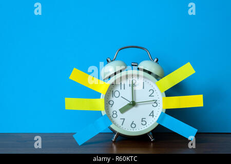 Note paper sticky and vintage alarm clock on table with copy space for add text notice something, list memo and schedule concept idea. Stock Photo